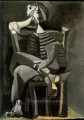 Hombre sentado tejiendo rayas 1939 cubismo Pablo Picasso